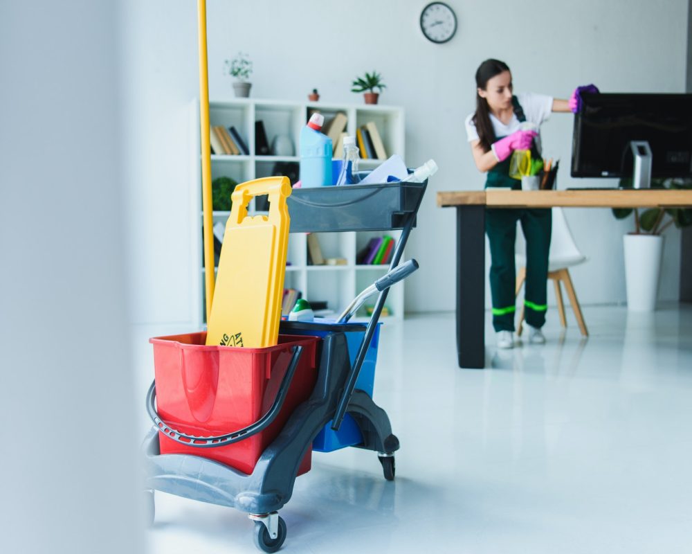 young-female-janitor-cleaning-office-with-various-cleaning-equipment.jpg young-female-janitor-cleaning-office-with-various-cleaning-equipment.jpg